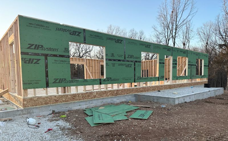 The exterior framing and weather protection wrap for a custom home builder project.